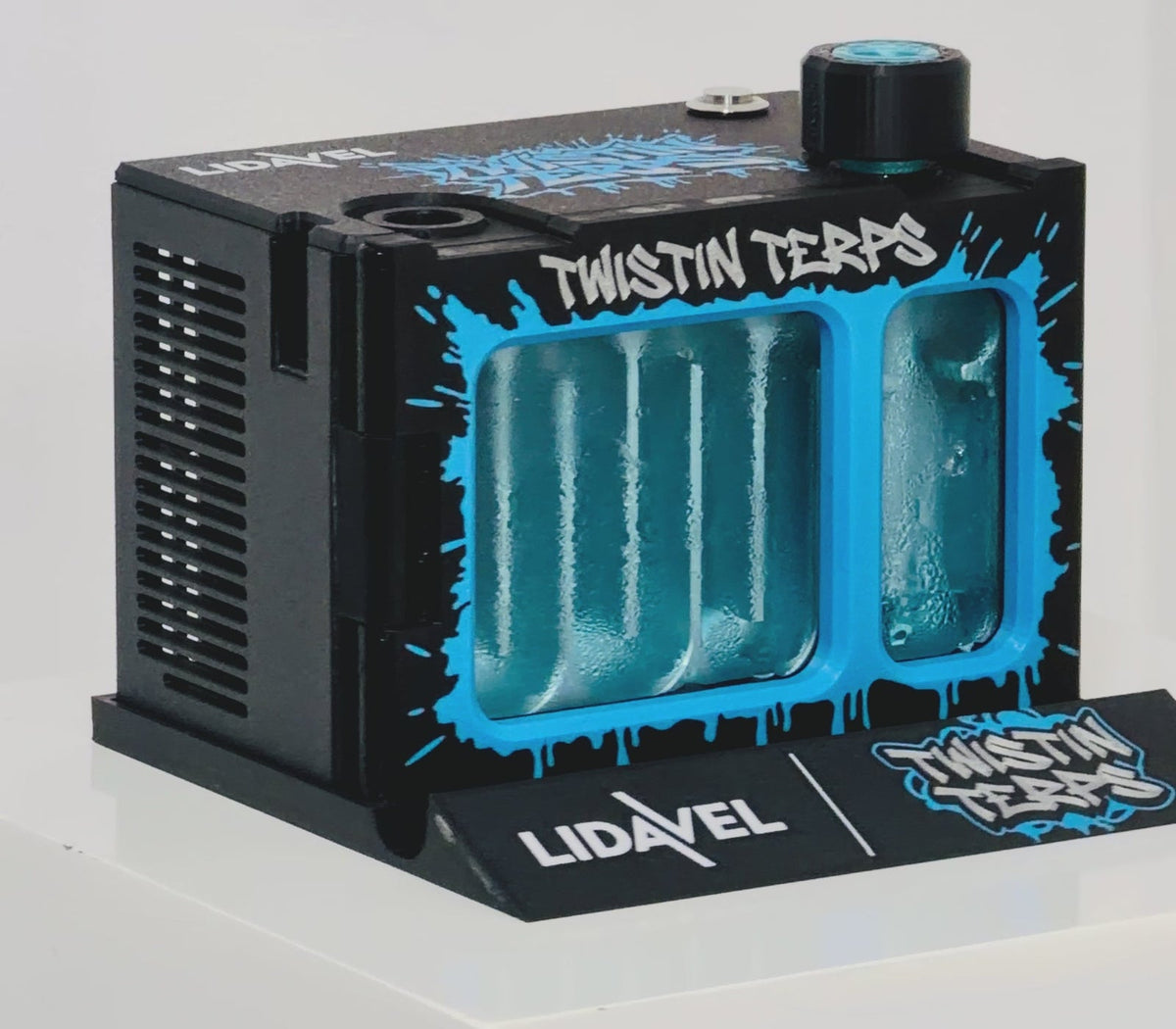 The Box V2 — TwistinTerps × Lidavel Artist Series, chrome-blue TwistinTerps artwork on a black electronic cooling unit