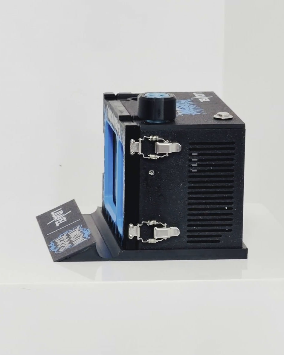 The Box V2 — TwistinTerps × Lidavel, side view showing the dual metal latches and ventilation grille